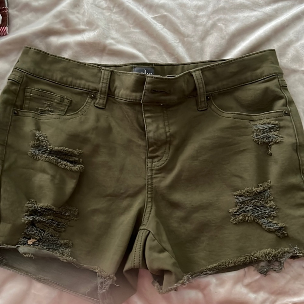 Distressed olive green denim shorts